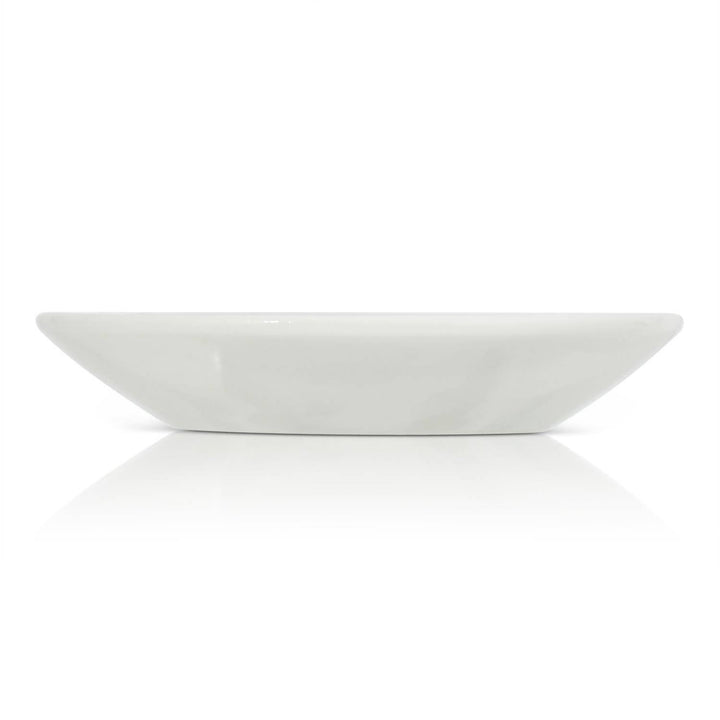 White ceramic trinket dish on a white background
