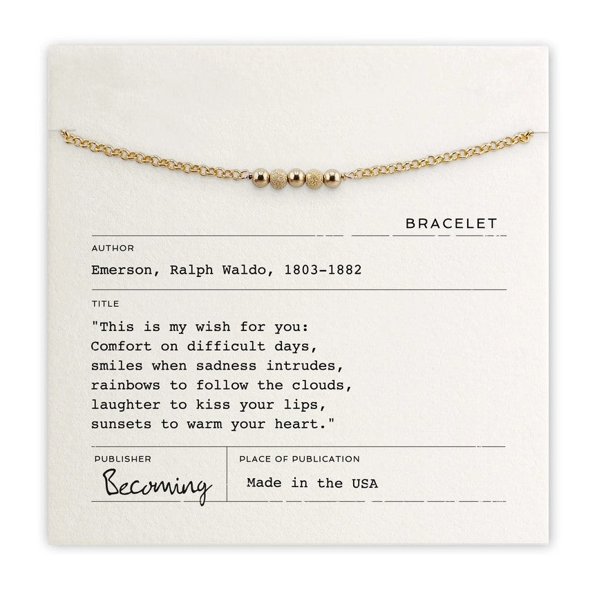 Beaded gold bracelet displayed on quote card reading “This is my wish for you” by Ralph Waldo Emerson, available in gold or silver.