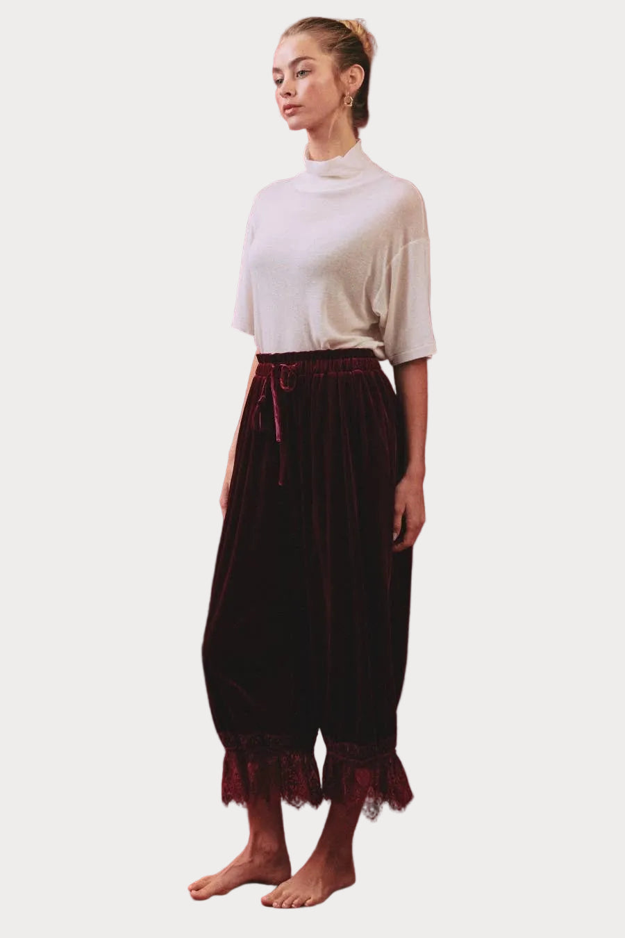 Deep merlot velvet bloomer pants with elastic drawstring waist, gathered legs and scalloped floral lace hems