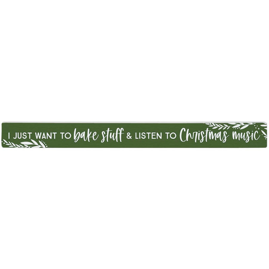 green wood talking stick with white text “I Just Want to Bake Stuff & Listen to Christmas Music”