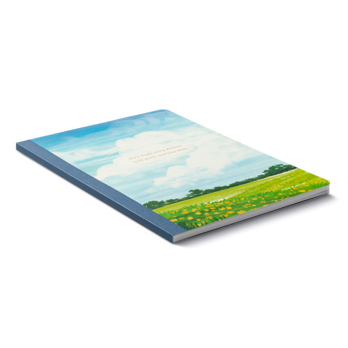 Notebook with a scenic cover of a field and sky on a white background