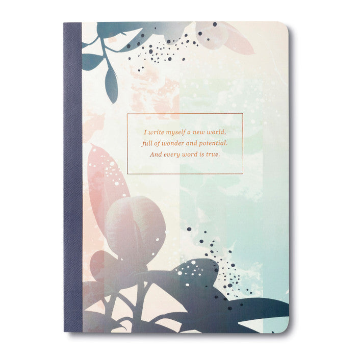 Notebook with floral design and motivational quote on a white background