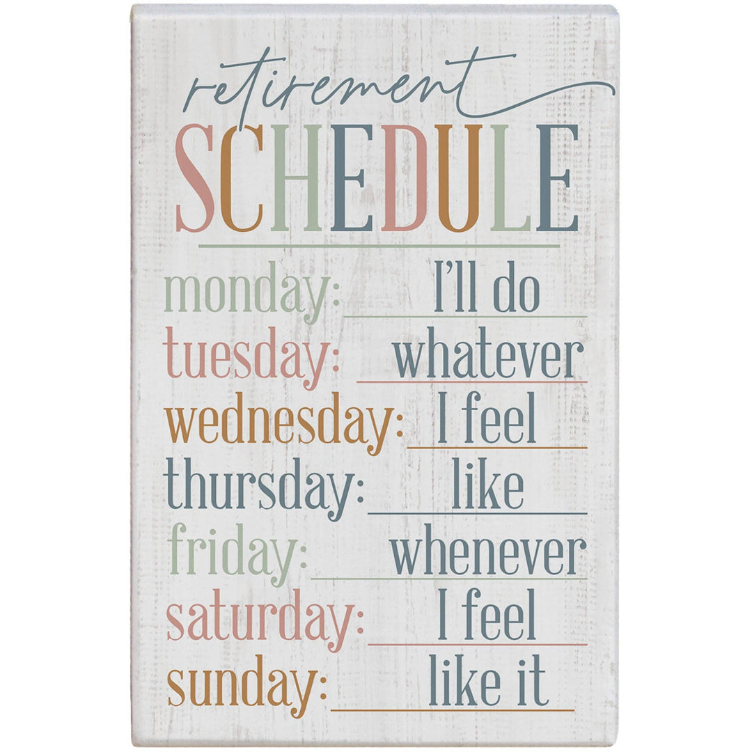 Wooden sign with humorous 'retirement schedule' text on a white background