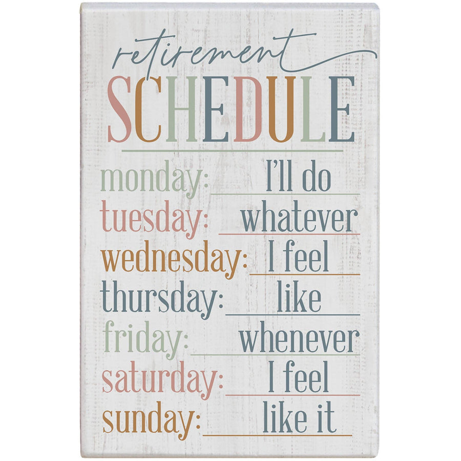 Wooden sign with humorous 'retirement schedule' text on a white background