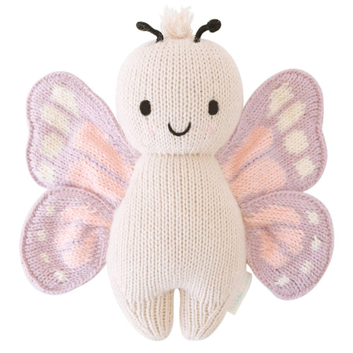 Knitted butterfly toy with pink and purple wings on a white background