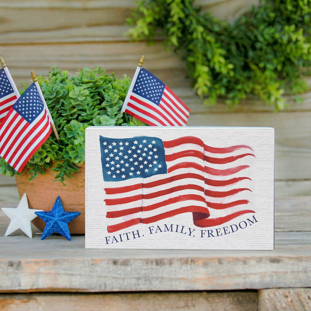Decorative sign with American flag design and 'Faith. Family.