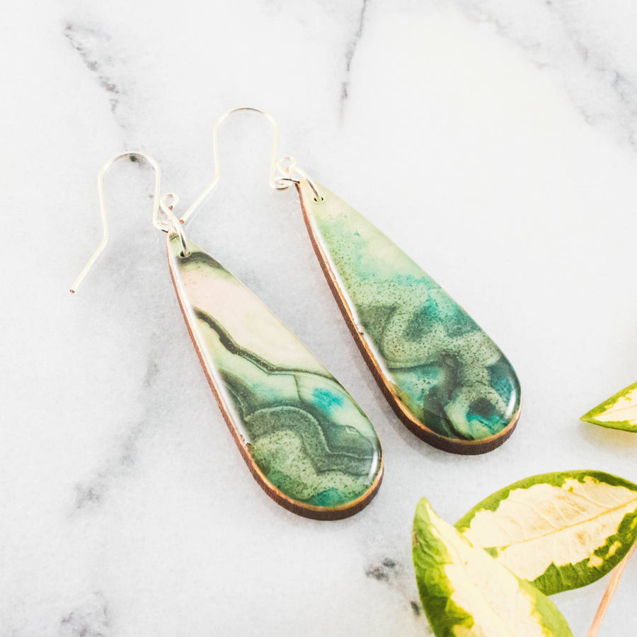 Teardrop green geode inspired wooden earrings with swirling jade turquoise and moss green design