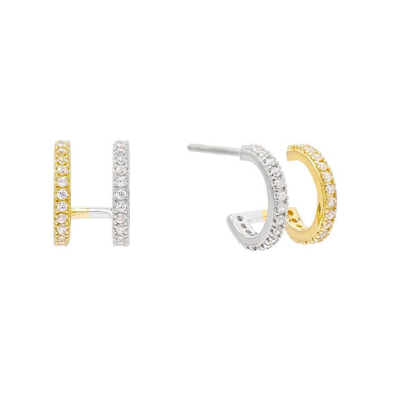 Mixed metal huggie earrings with pavé CZ stones in gold and silver.