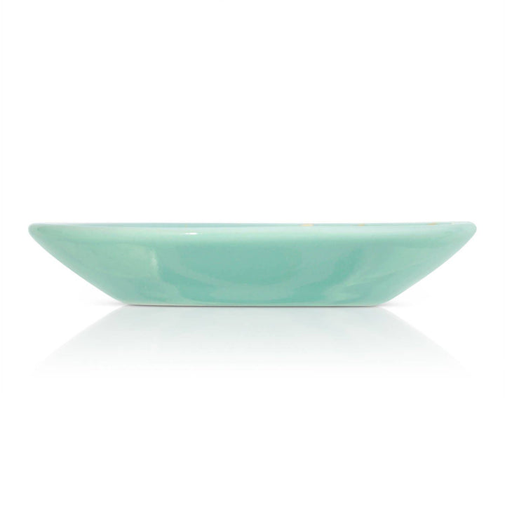 Mint green trinket ceramic dish on a white background