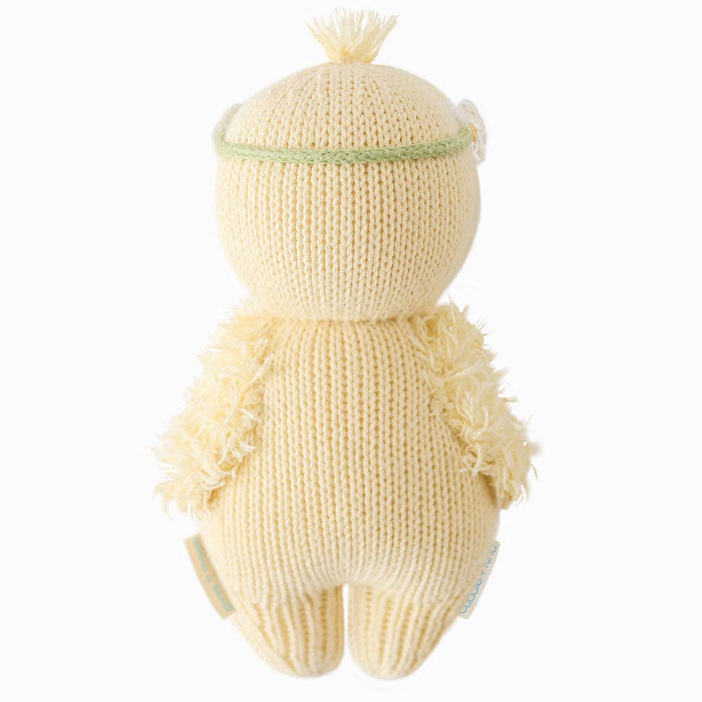 Back of Knitted baby duck with a plain background