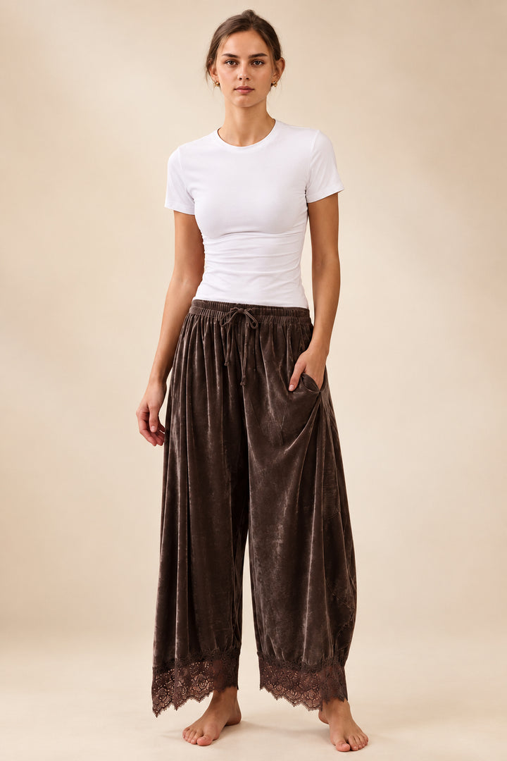 Deep brown velvet wide leg pants with elastic drawstring waistband and scalloped floral lace hem detail