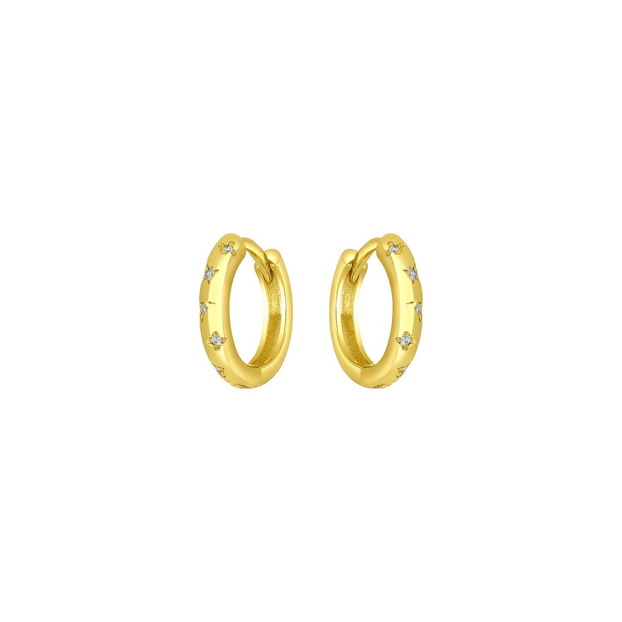 Gold huggie earrings with CZ stones and slim celestial-inspired design.