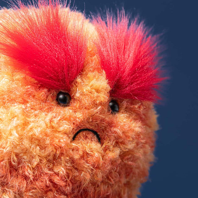 closeup of face amuseables planet mars plush orange space stuffed toy grumpy face