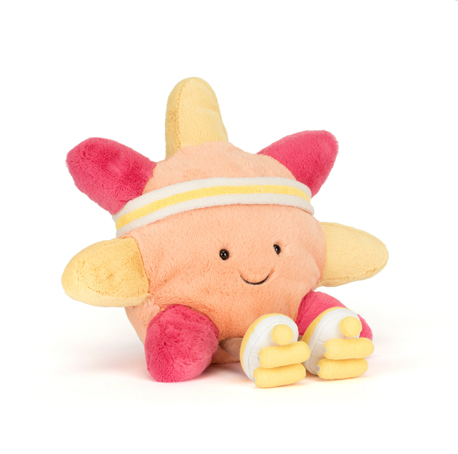 Plush toy sun with pink and yellow colors on a white background. amuseables sun roller skates plush with pink and yellow roller skate details