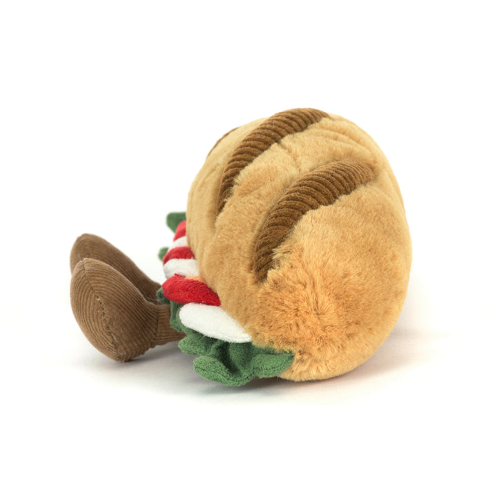Amuseables Caprese Baguette plush with tomato, mozzarella, and basil layers and corduroy feet side view