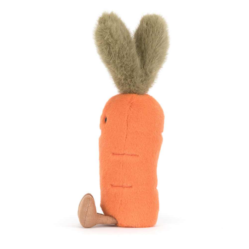 Amuseables Carrot plush toy with soft orange body, fluffy green top, stitched smile, and corduroy feet on a white background
