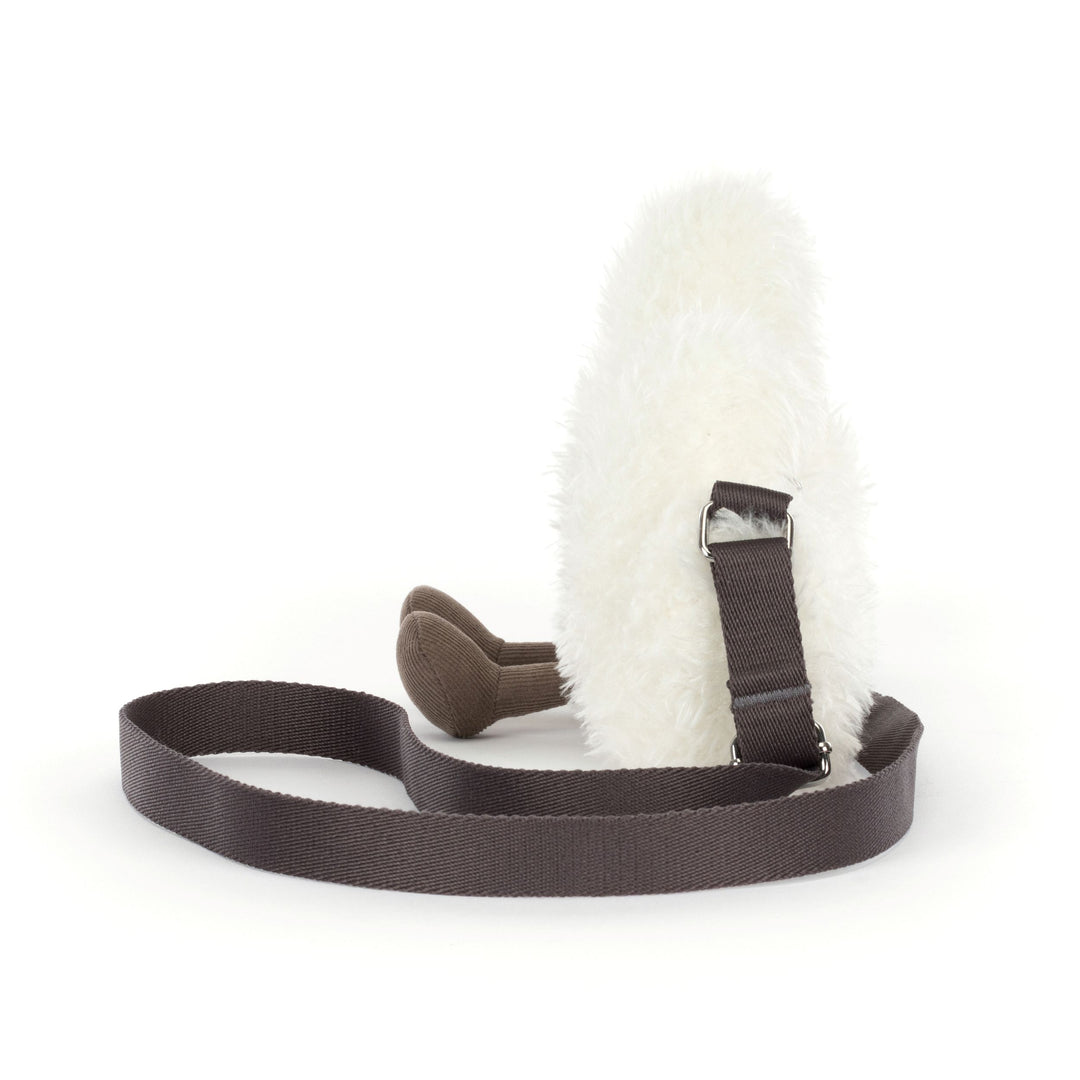 cream white fluffy cloud plush shoulder bag with smiling face, corduroy feet, adjustable strap, and zip closure on a white background. side view