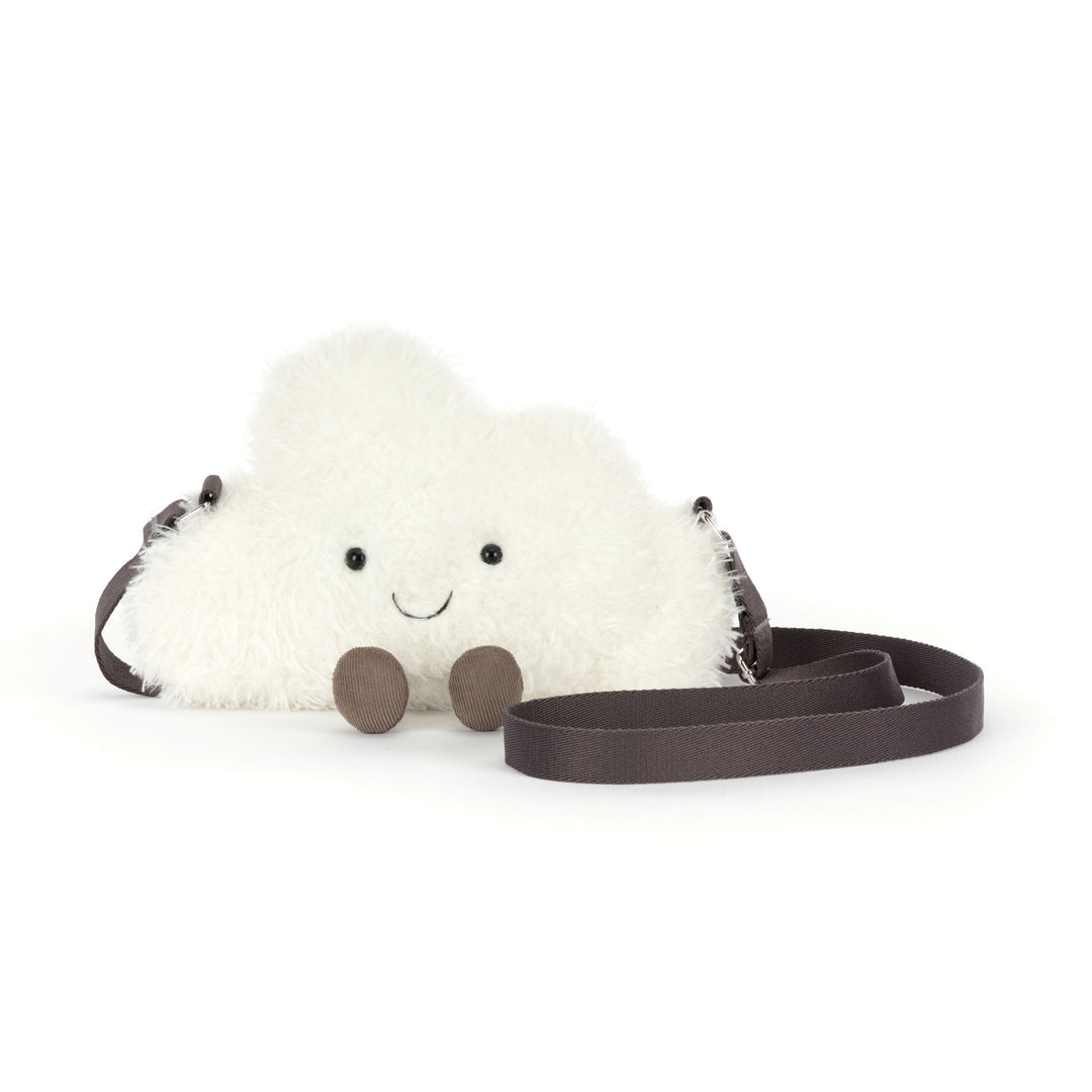 cream white fluffy cloud plush shoulder bag with smiling face, corduroy feet, adjustable strap, and zip closure on a white background