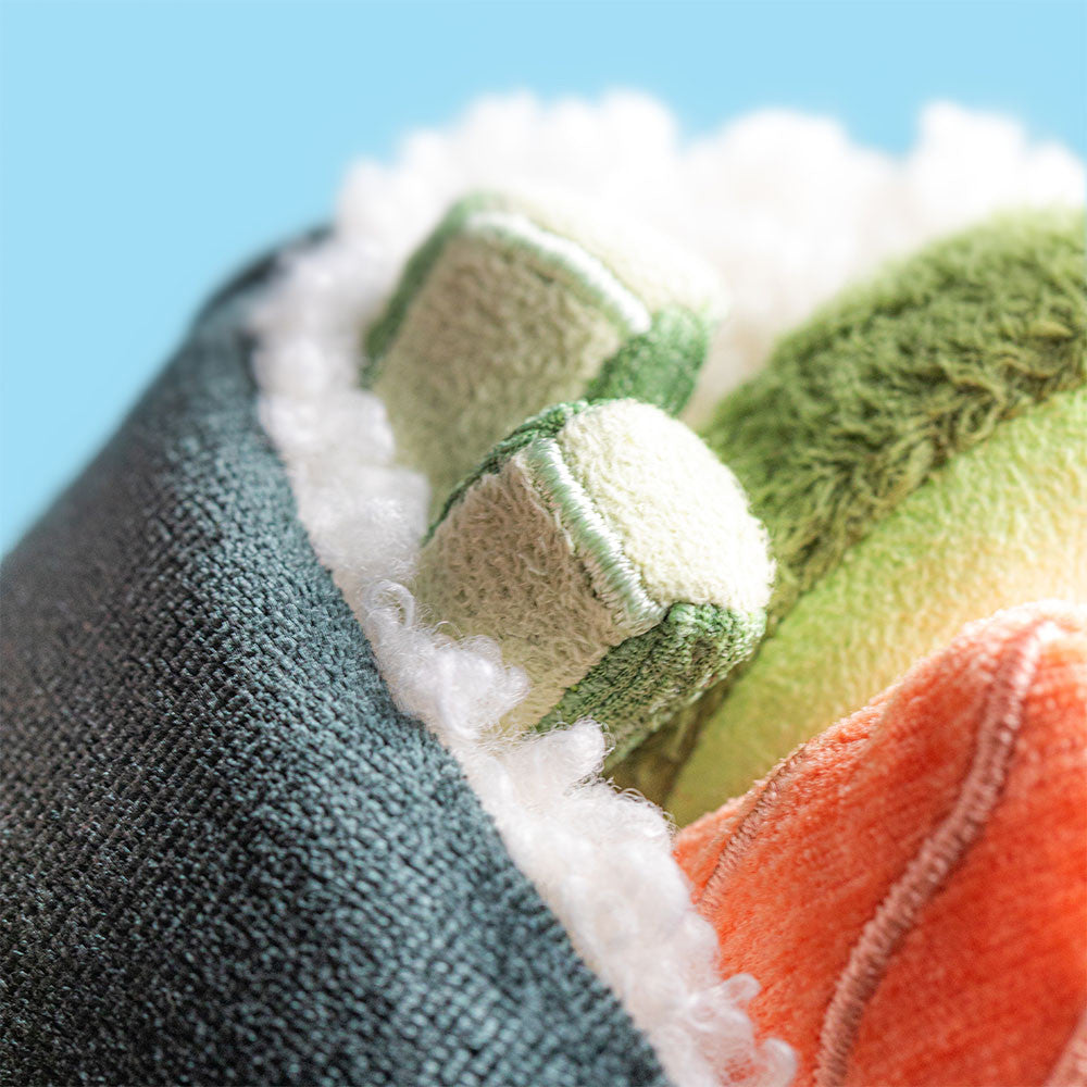 Closup of fillings Amuseables Coneroi Temaki plush sushi roll with smiling face, nori wrap, and colorful fillings