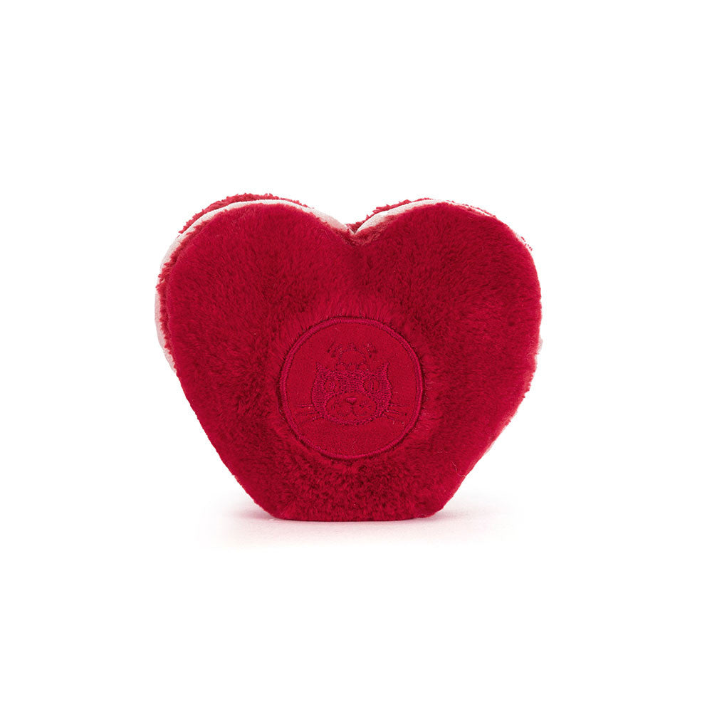 Jellycat Amuseables Arlette Heart Macaron plush with soft red heart shape and stitched smile on a white background. Rear facing showing embroidered Jellycat logo on the bach