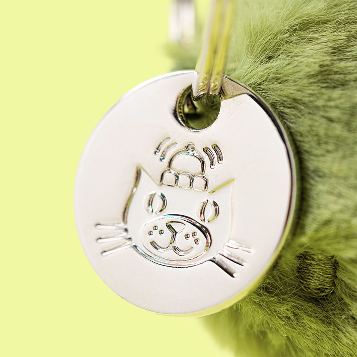 closeup of silver metal Jellycat logo tag