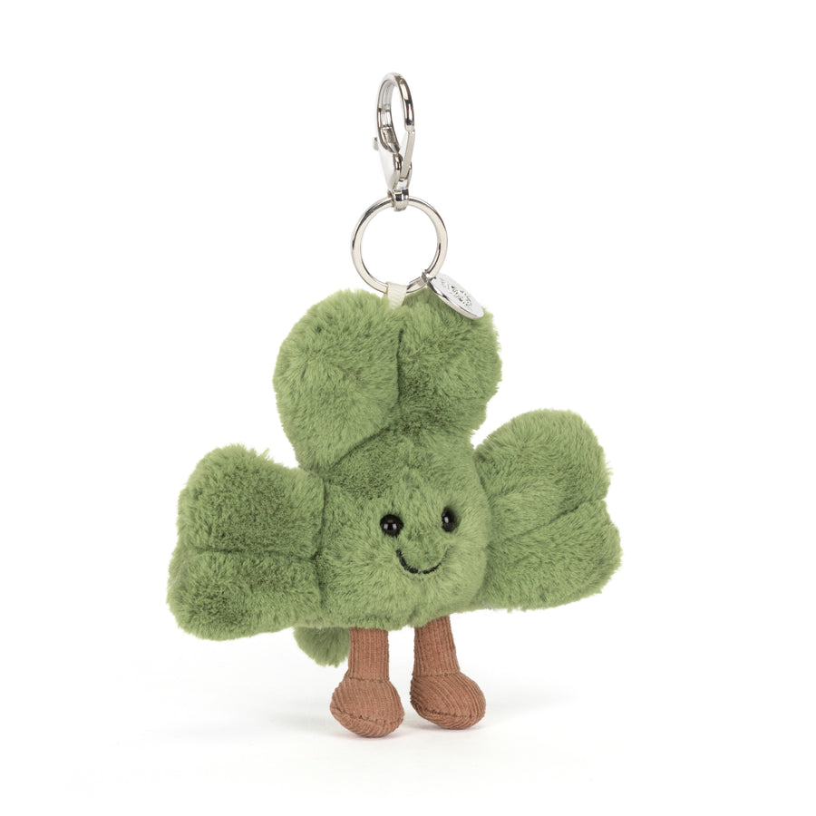 Amuseables Siofra Shamrock plush bag charm with soft green leaves, smiling face, corduroy legs, and silver clip on a white background