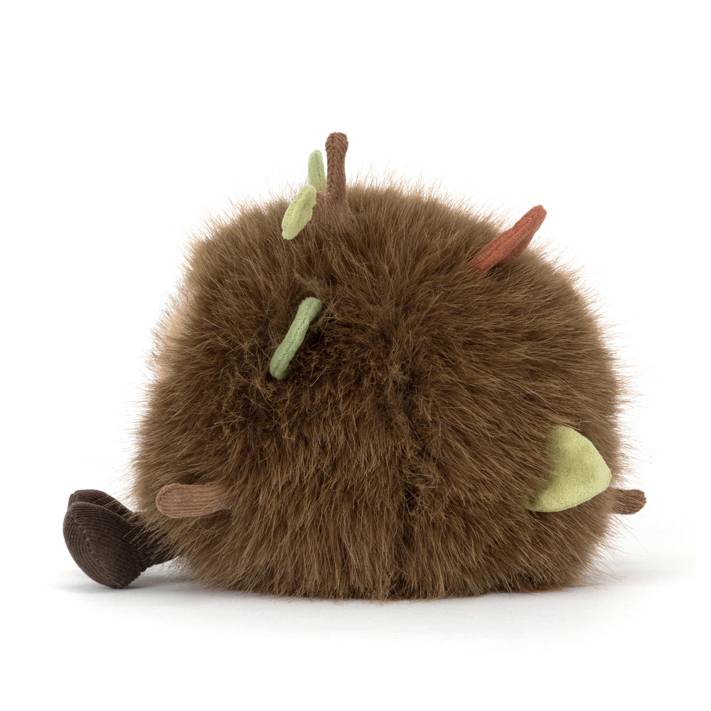 Amuseables Mulshi Woodland Floor Jellycat plush with fluffy brown fur, embroidered leaves, twigs and corduroy feet on a white background.