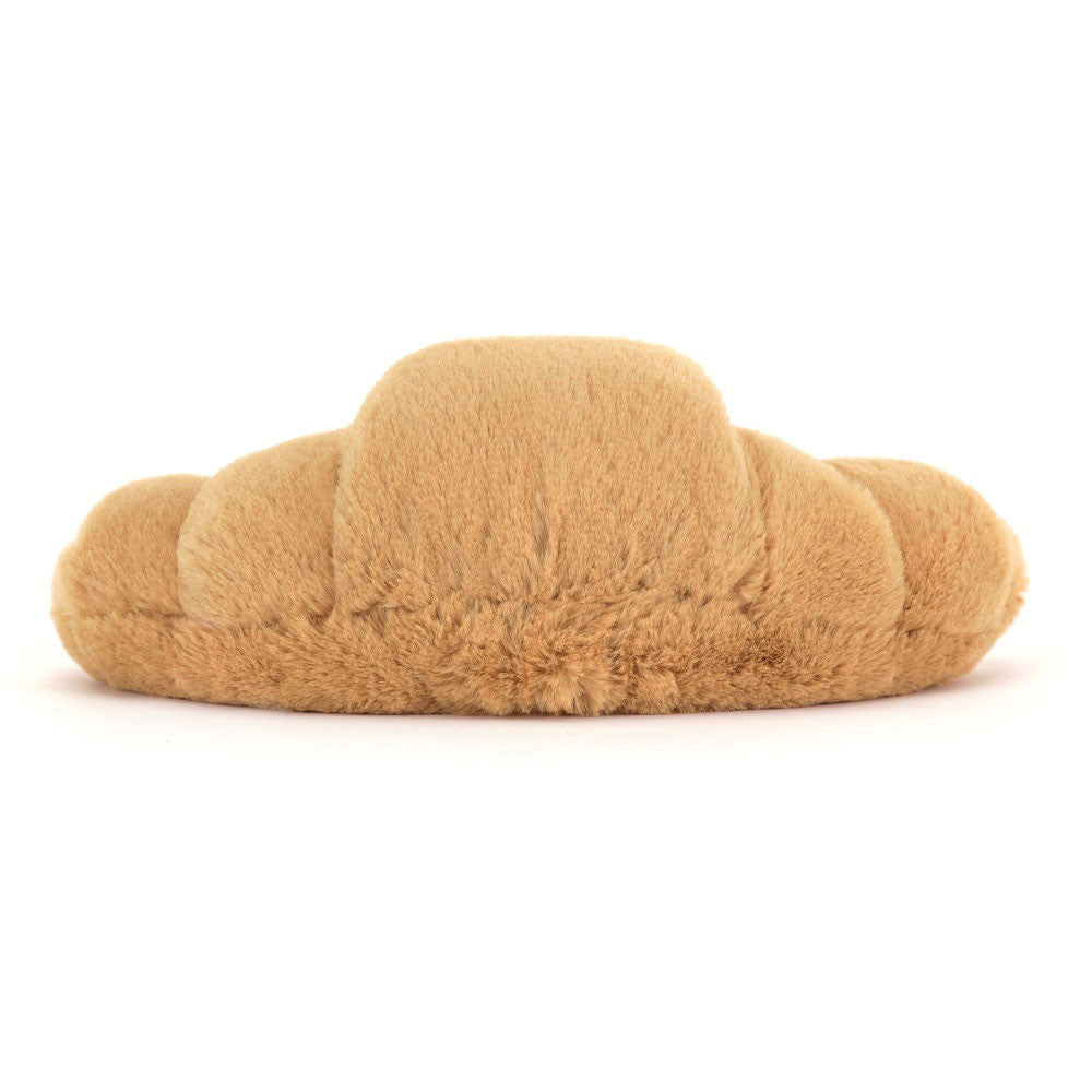 “Amuseables Croissant plush by Jellycat with smiling face and corduroy legs” back view
