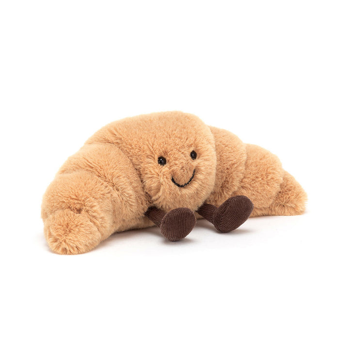 “Amuseables Croissant plush by Jellycat with smiling face and corduroy legs”