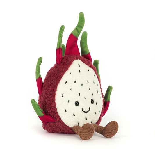 Jellycat Amuseables Dragon Fruit plush, featuring a fuchsia fluffy exterior, a white speckled face with a smile, and brown corduroy feet.