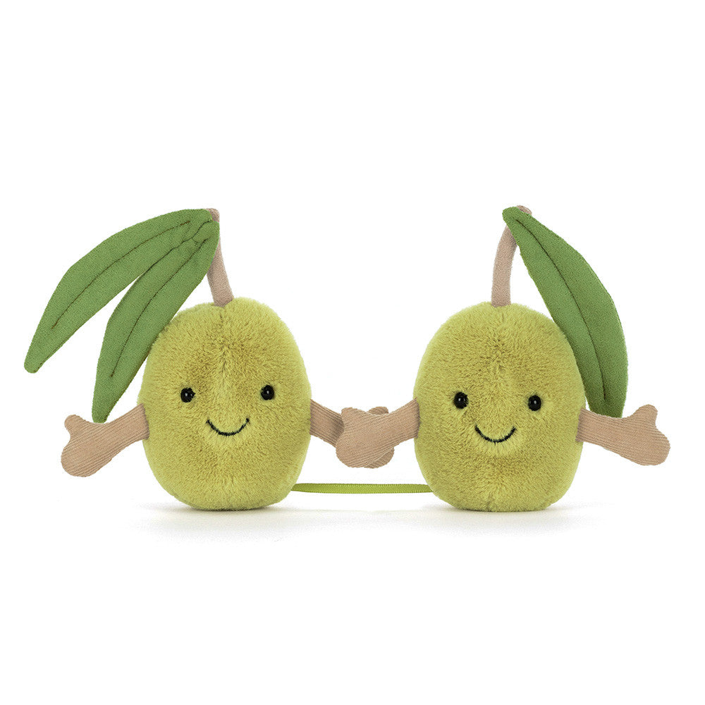 Two smiling plush olives connected by ribbon and velcro hands with soft green leaves