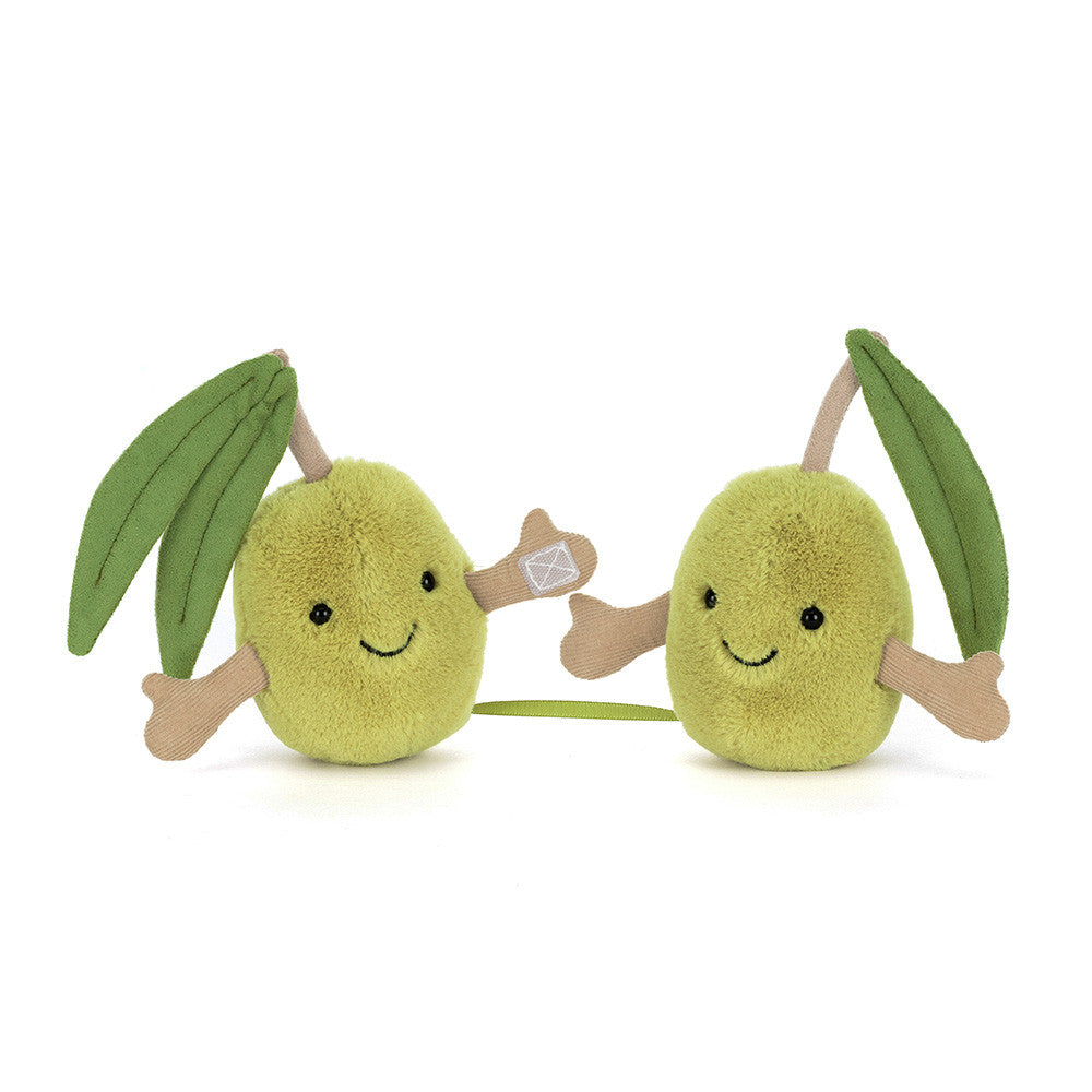 Two smiling plush olives connected by ribbon and velcro hands with soft green leaves