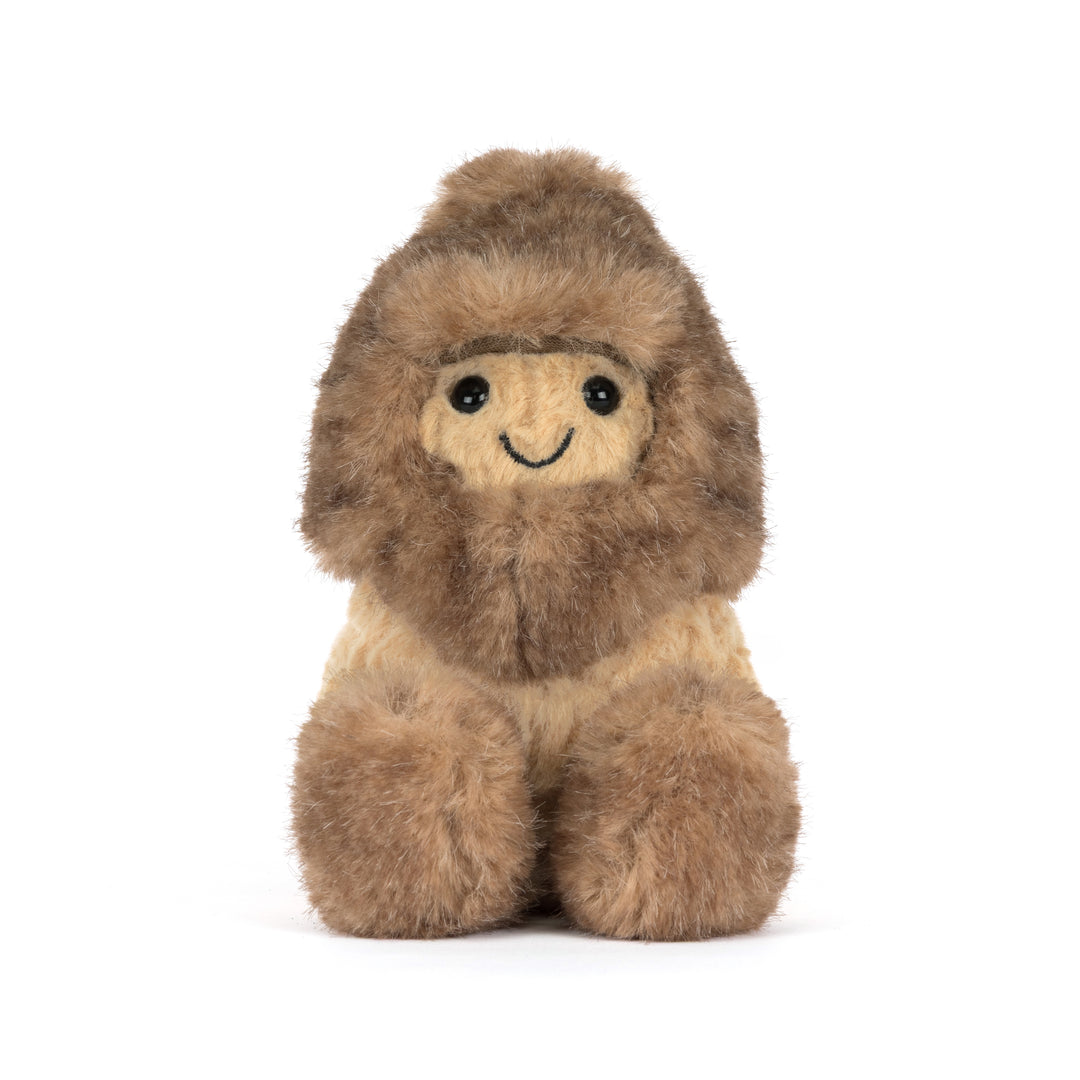Jellycat Amuseables Peanut Yeti Outfit plush featuring a smiling peanut dressed in a fluffy brown and cream Yeti costume with oversized fuzzy feet.