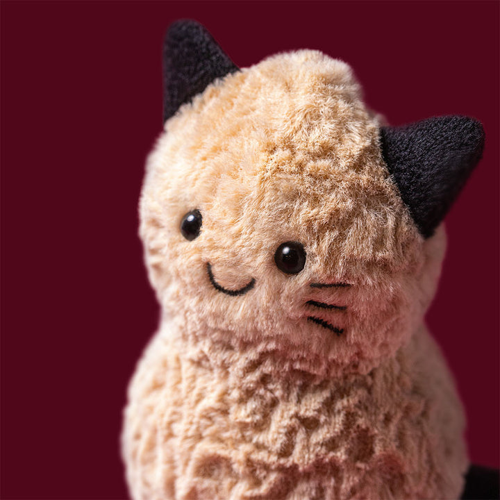 Jellycat Amuseables Peanut Cat golden tan plush peanut with black cat ears whiskers paws and curled tail