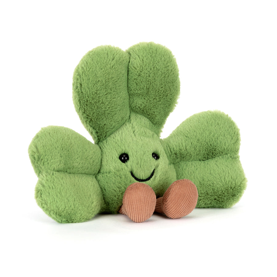 green shamrock plush with smiling face and corduroy feet