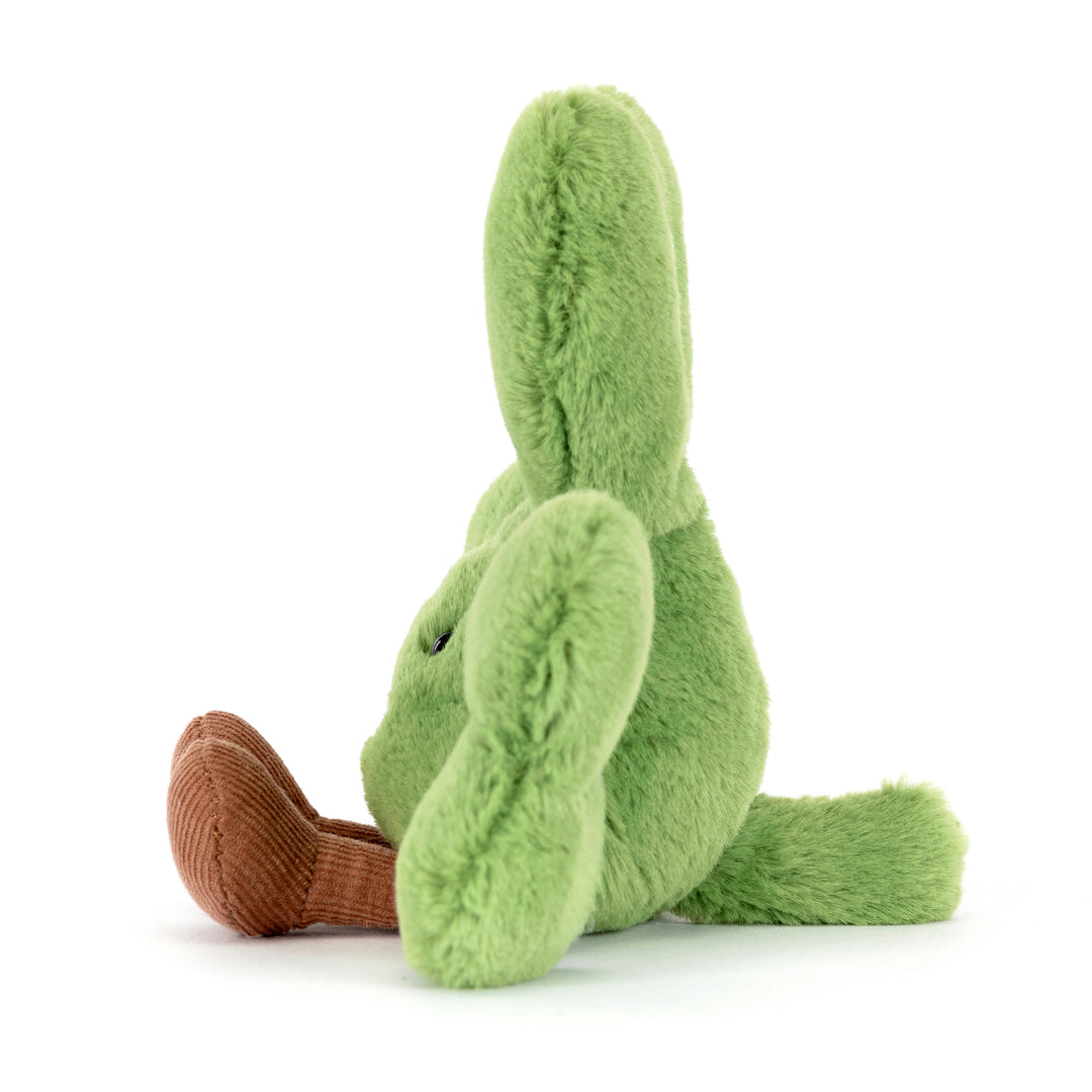 green shamrock plush with smiling face and corduroy feet