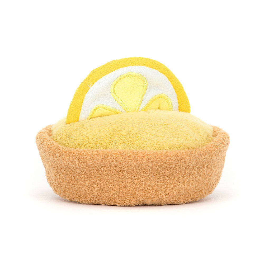 lemon tart plush with golden pastry crust, lemon custard filling, lemon slice topper