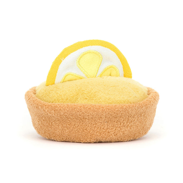 lemon tart plush with golden pastry crust, lemon custard filling, lemon slice topper