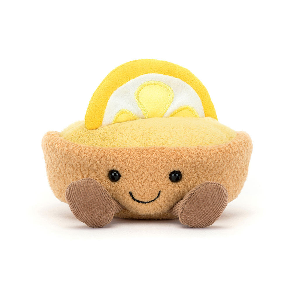 smiling lemon tart plush with golden pastry crust, lemon custard filling, lemon slice topper, and corduroy legs sitting upright