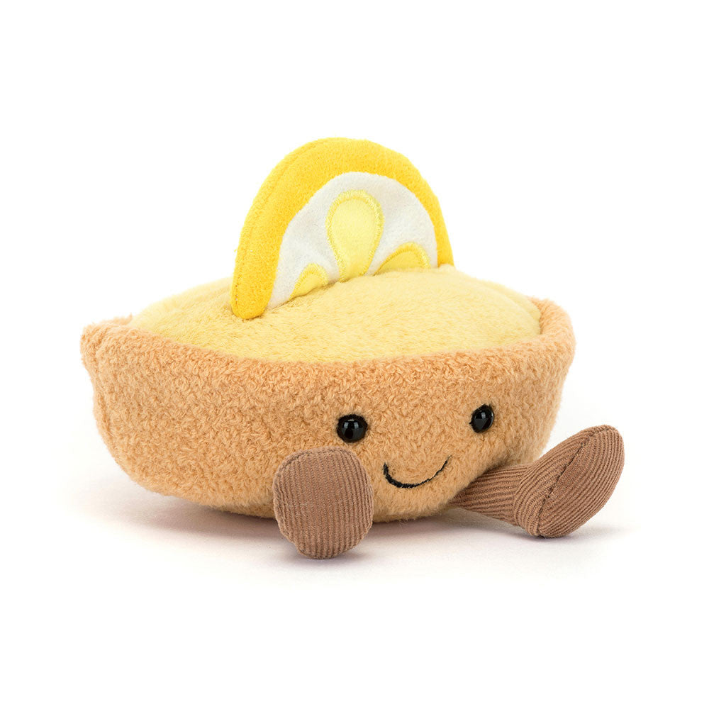 smiling lemon tart plush with golden pastry crust, lemon custard filling, lemon slice topper, and corduroy legs sitting upright