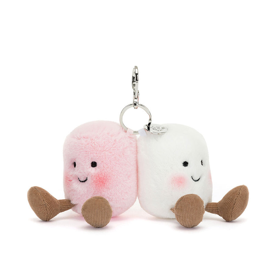 Amuseables Pair of Marshmallows Bag Charm. These scrumptious twins come in pastel pink and cream, with embroidered faces, blushing cheeks and toasty corduroy boots. Clip them on  your favorite bag with a strong silver claw and shining Jellycat tag.