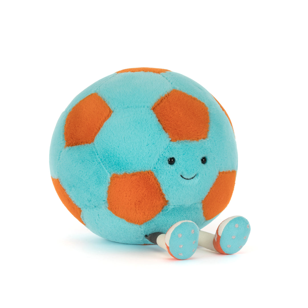 Plush toy turquoise & orange soccer ball with a smiling face on a white background