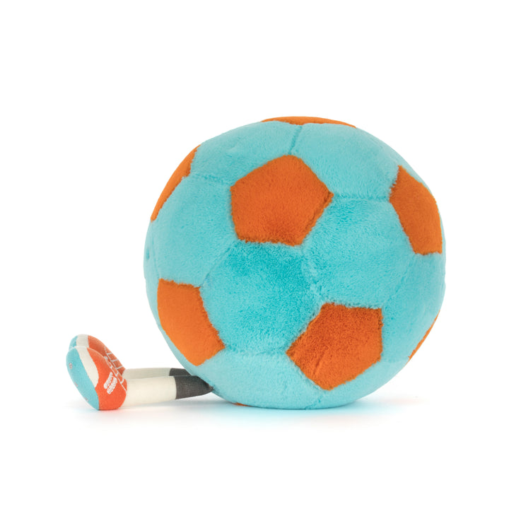 Plush toy turquoise & orange soccer ball with a smiling face on a white background side view facing left