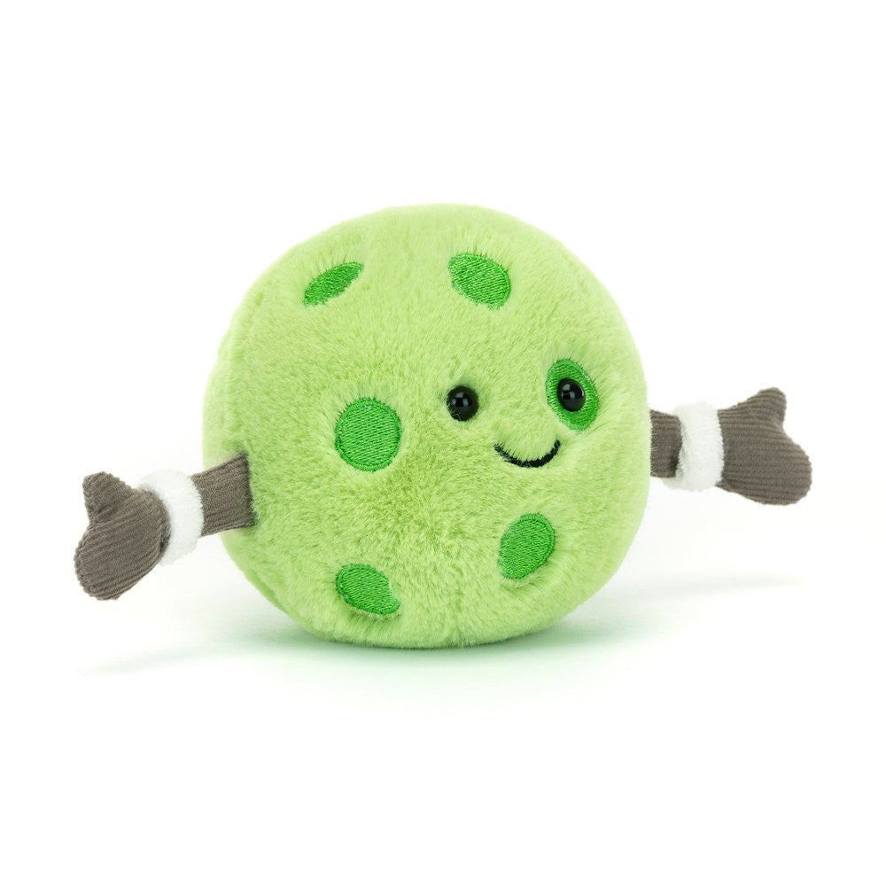 Amuseables Sports Pickleball - A perky green go-getter who is constantly ready for a game (or two)! This fuzzy green ball has embroidery "pickle" spots, corduroy arms, each sporting white sweat bands and a smiling face. 
