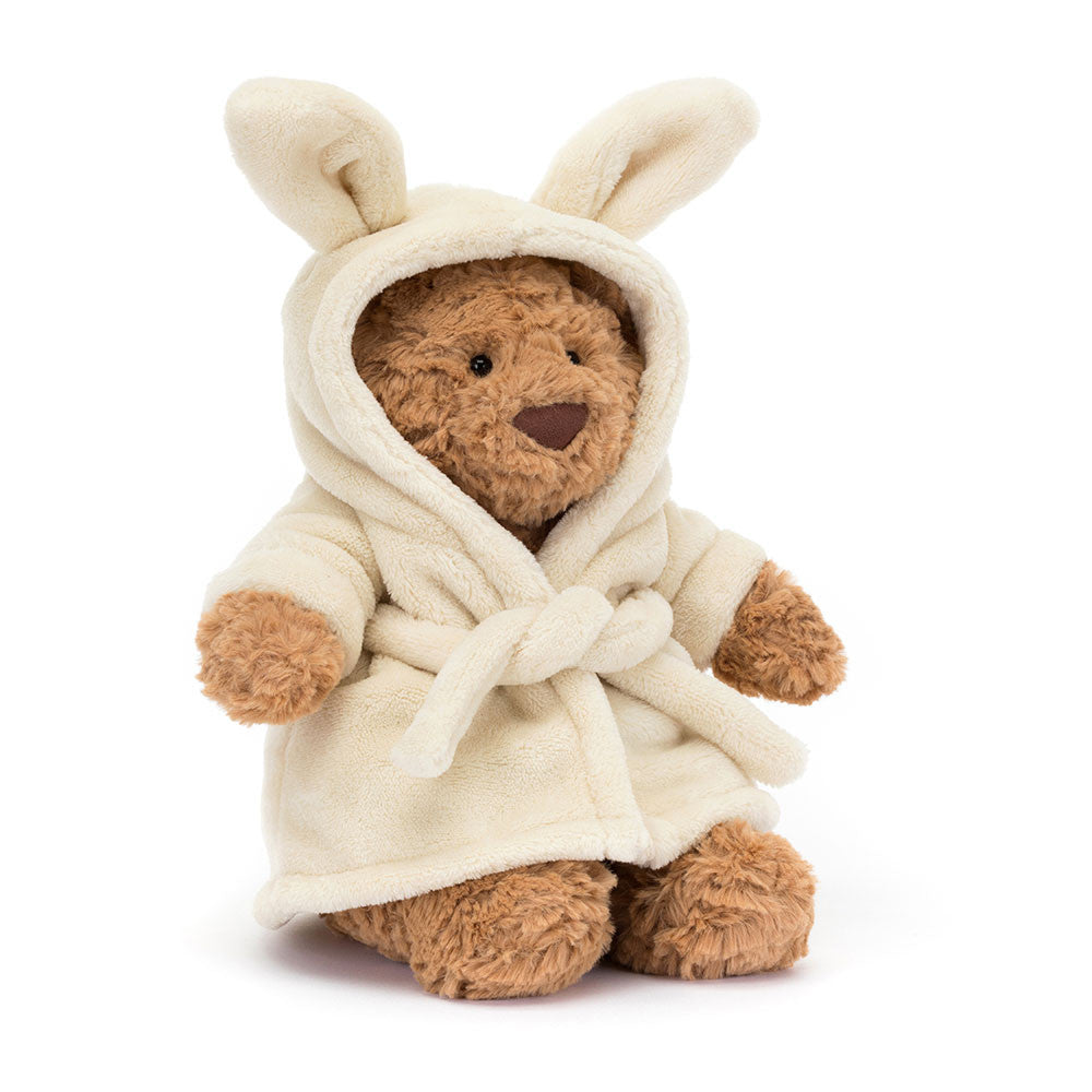 “Jellycat Bartholomew Bear wearing soft cream bathrobe with bunny-ear hood”