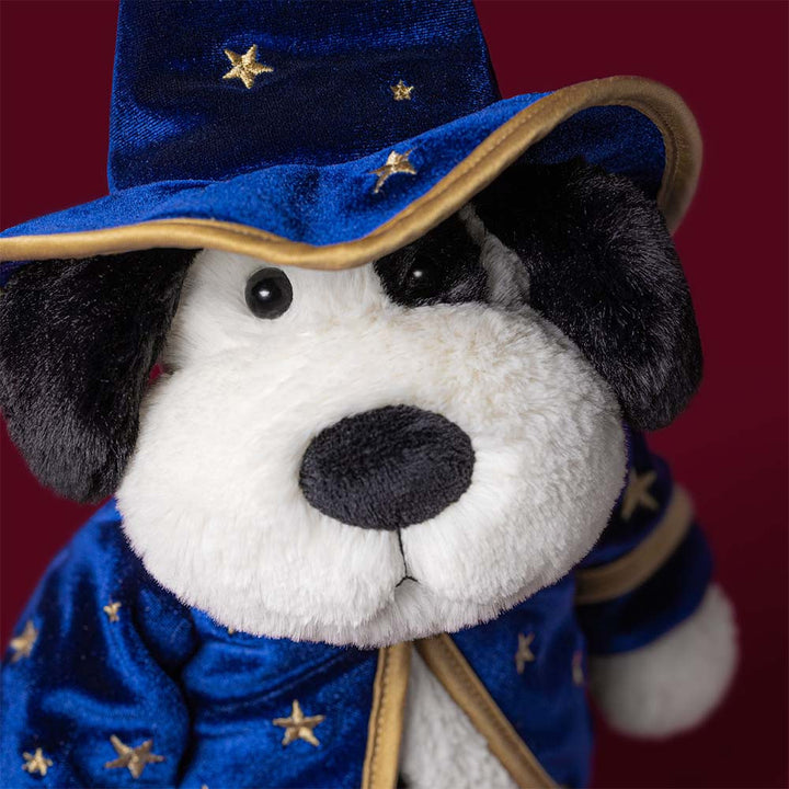 Jellycat Rufferty Puppy Wizard black and cream plush dog wearing blue starry wizard hat and cape with gold trim