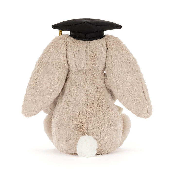 Soft plush bunny wearing graduation cap and holding a diploma. Back view