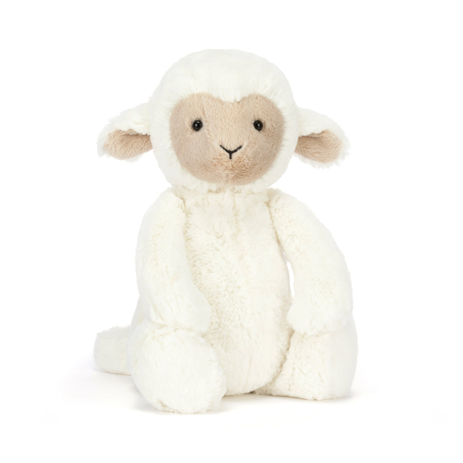 soft white lamb plush sitting upright with floppy legs