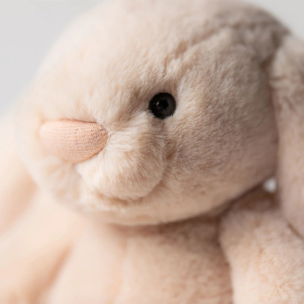 Jellycat Bashful Luxe Bunny Willow close-up showing golden beige plush fur, black eyes and sparkly pink nose