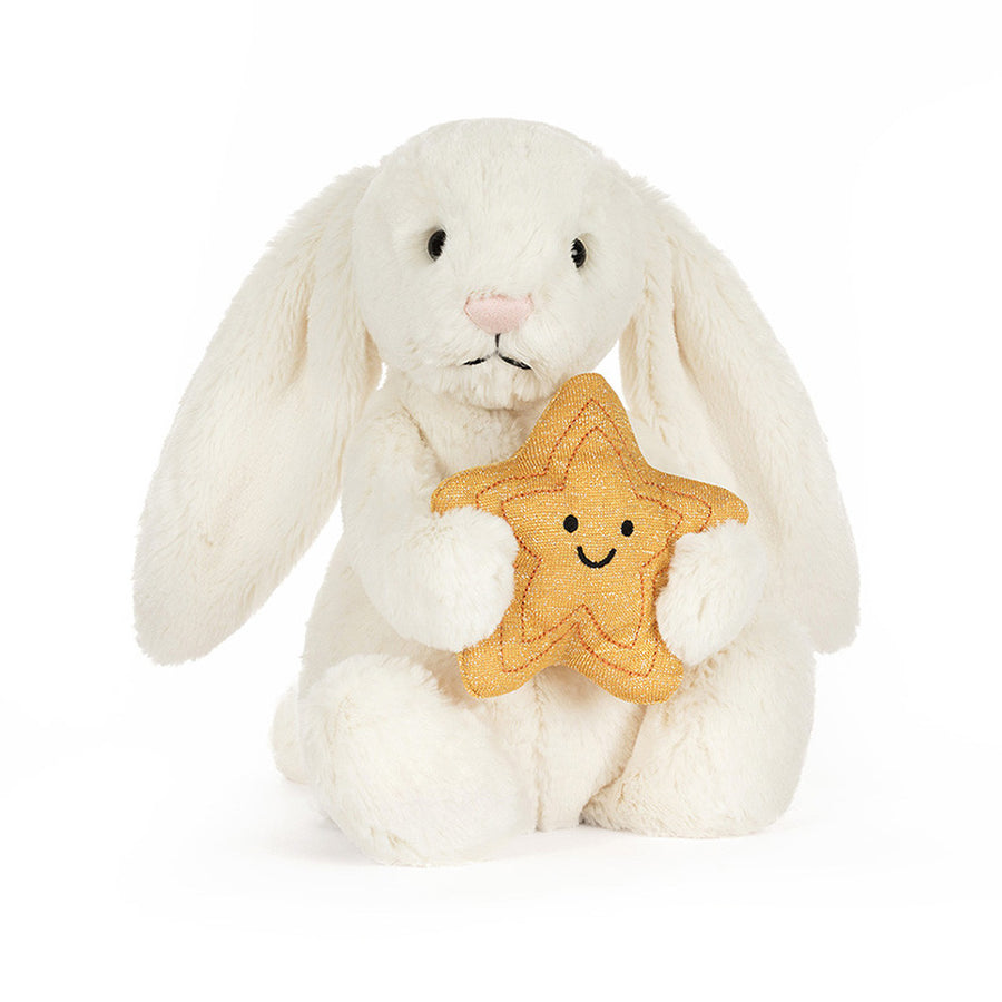 Cream plush bunny holding a smiling golden star